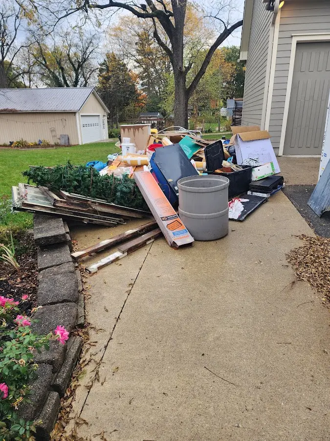Dumpster being loaded with debris for 30 Yard Dumpster Rental in Florida Ridge